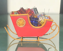 "Santa's Sleigh" filled with wrapped gifts by Lori Mitchell
